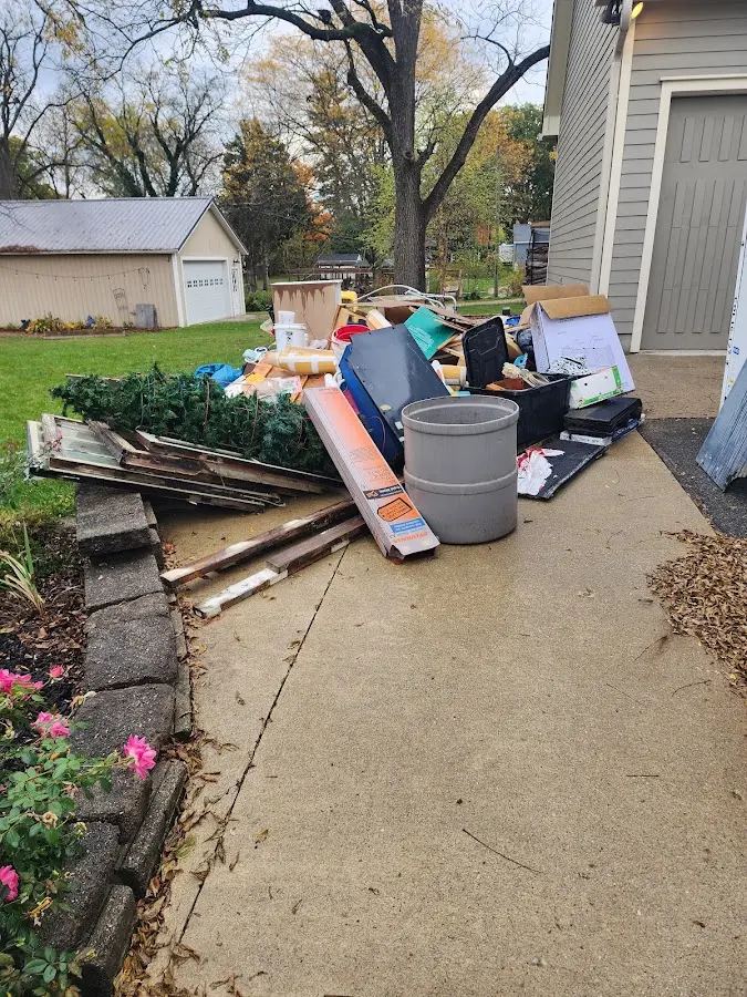 Dumpster being loaded with debris for Estate Cleanout Dumpster Rental in Bethel Park